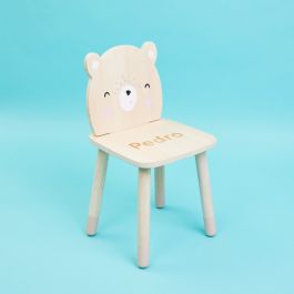 a teddy bear on the chair