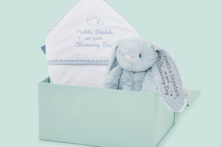 Blue bunny and white blanket in blue box