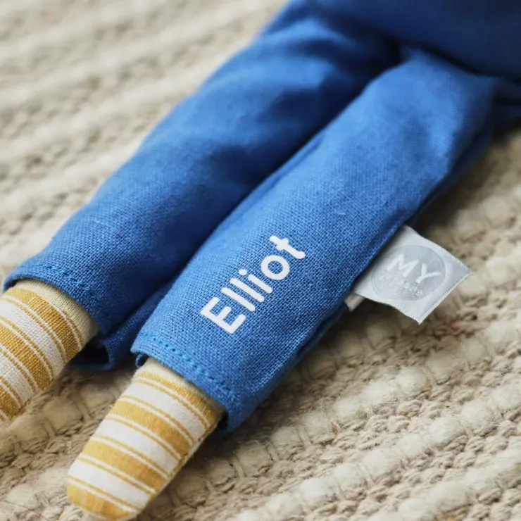 Dolls legs with Elliot written on trousers